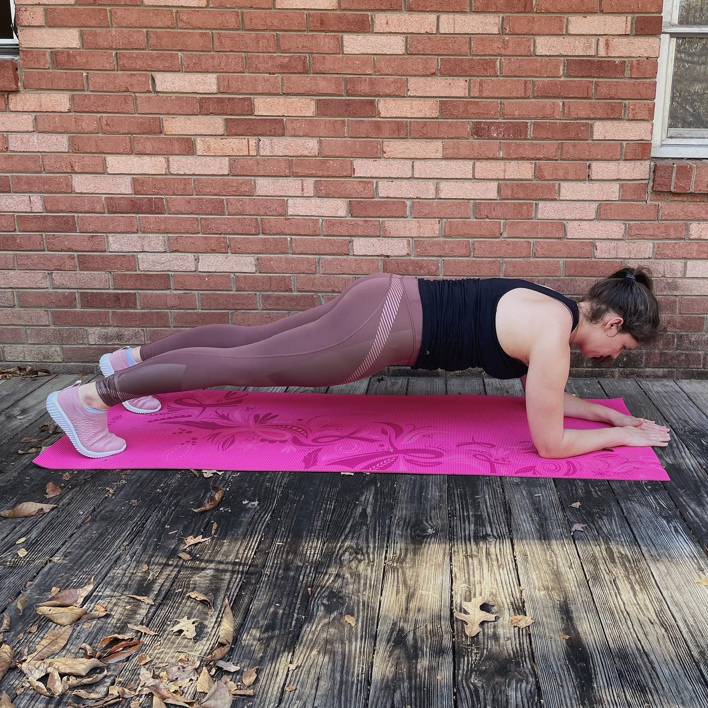 Female doing plank on elbows